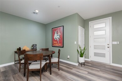Dining space with wood finished floors, visible ve