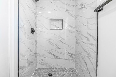 Bathroom featuring a shower stall