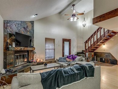Living room featuring a tile fireplace, hardwood /