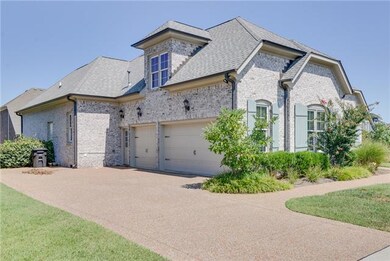All brick home with a three-car, side entry garage!  And the garage is finished and painted on the inside!