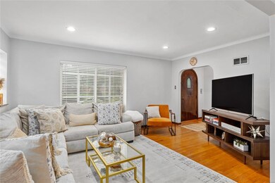 Large window in living room allows for plentiful n
