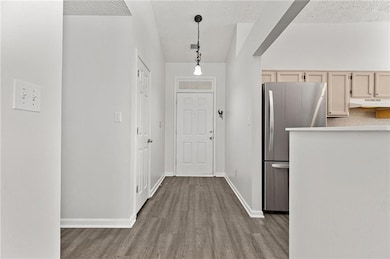 View into the open concept kitchen and of the fron