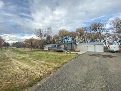 2 - front of home with 2 bay shop