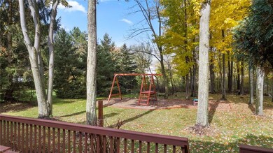 Deck view to private wooded back yard. Jungle gym 