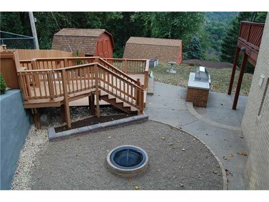 Exterior Back. Newly installed fire pit and landsc