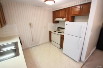 Kitchen has electrical stove / oven & refrigerator