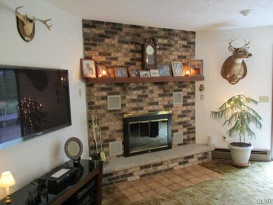 Corner brick fireplace in family room