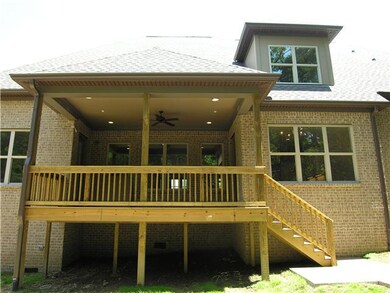 Rear Covered Porch Deck, with doors to breakfast room, & master bedroom.