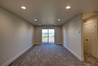Spare room featuring carpet flooring