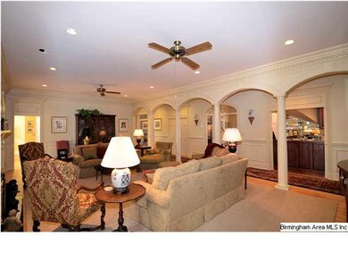 Elegant archways are seen from great room.   Beyon