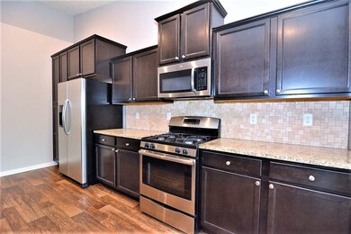 Lovely backsplash and granite countertops
