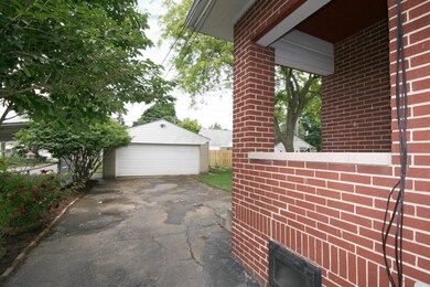 Garage and rear patio off kitchen