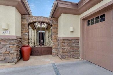 Stone wall with Wrought Iron Gate