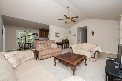 Another view of the living room, open to the kitch