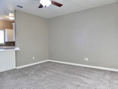 Living Room divided by a small breakfast bar.