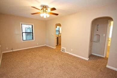 Living Room- Beautiful arched entryways.