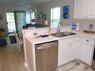 Kitchen with sink, stainless steel dishwasher, whi