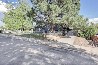 View of front of house with concrete driveway, board and batten siding, and a garage