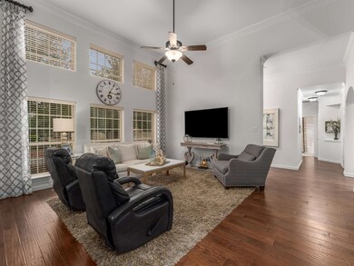 The living room is filled with natural light and b