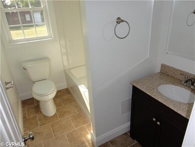 Bathroom - Hall Bath with Kholer Elongated Toilet,
