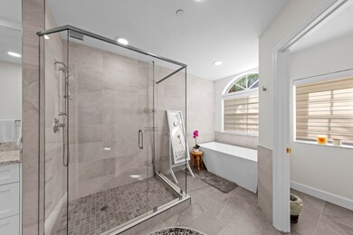 Full bathroom with a soaking tub, a shower stall, recessed lighting, and vanity