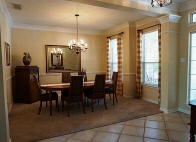Generously sized formal dining room  accommodates a large dining table, with usable wall space for hutch or buffet server.