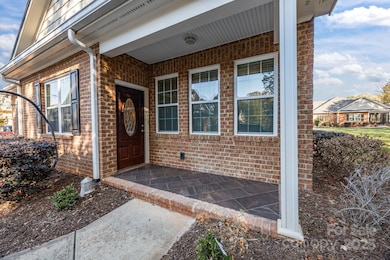Inviting front porch sets the tone for this beautiful townhome