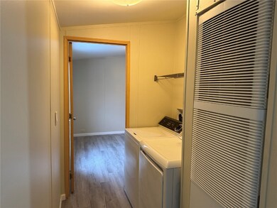 Laundry room with separate washer and dryer and LV