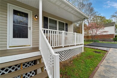 Property entrance featuring covered porch
