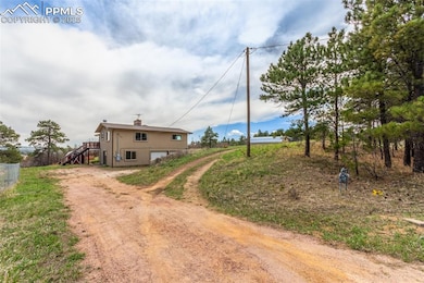 As seen from Draco Drive. You can pull into the bottom level of the home to the garage or to the top of the driveway and walk to the front entrance.  The driveway is a U driveway that has a entrance and exit from the bottom and top of the driveway.