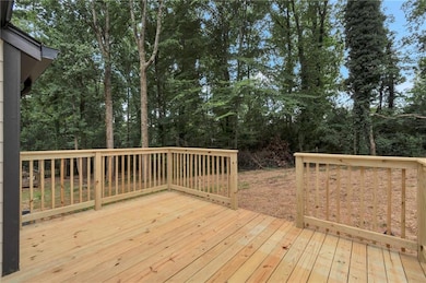 Wooden terrace with view of scattered trees