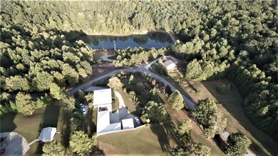 DRONE VIEW TO SHOW HOME OVERLOOKING SMALL 2 1/2 AC