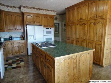 Awesome kitchen with oak cabinetry and center isla