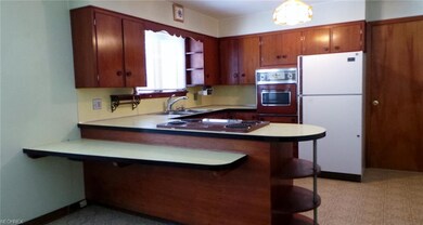 Breakfast bar , cook top, wall oven & refrigerator