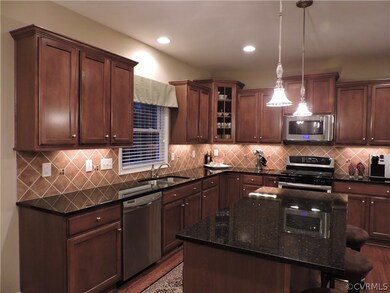 Custom kitchen, large island, custom lighting.