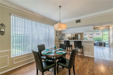 formal dining area with crown molding