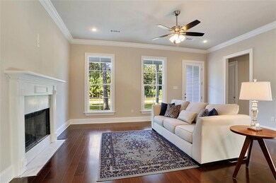 Den with lots of light with wood floors, high ceil