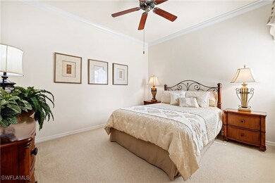 Bedroom #2 with light colored carpet, ornamental m