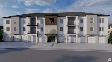 View of building exterior featuring a garage and driveway