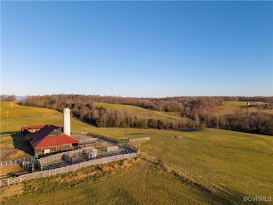 Birds eye view of property with a rural view