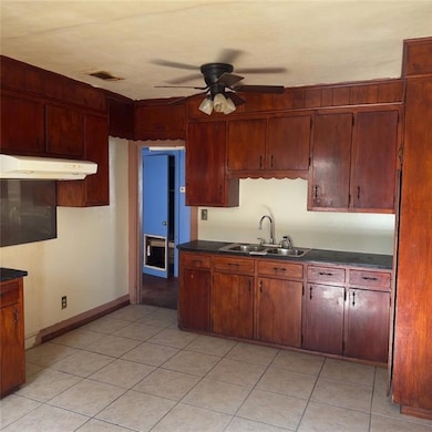 Kitchen featuring light tile patterned flooring, c