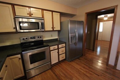The kitchen features an abundance of cabinet space