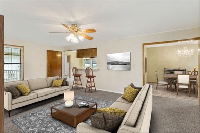 Large family room open to kitchen and dining area ~