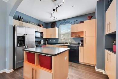 Kitchen featuring a kitchen island, dark countert