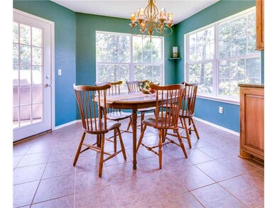 Dining Room. Dining space easily accommodates a large table and looks out over the tree-lined back yard.