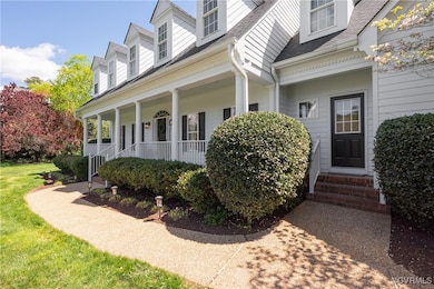 View of side of property featuring a porch and a s