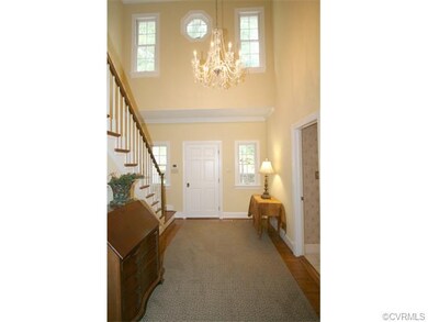2-story open foyer with access to the Hall Bath.
