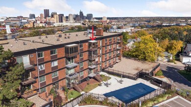 This top level unit offers a view of the pool and community gardens.