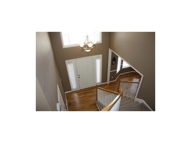 2 Story entry with Palladium window and hardwood f