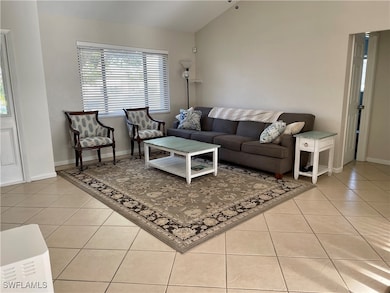Living area featuring light tile patterned floorin